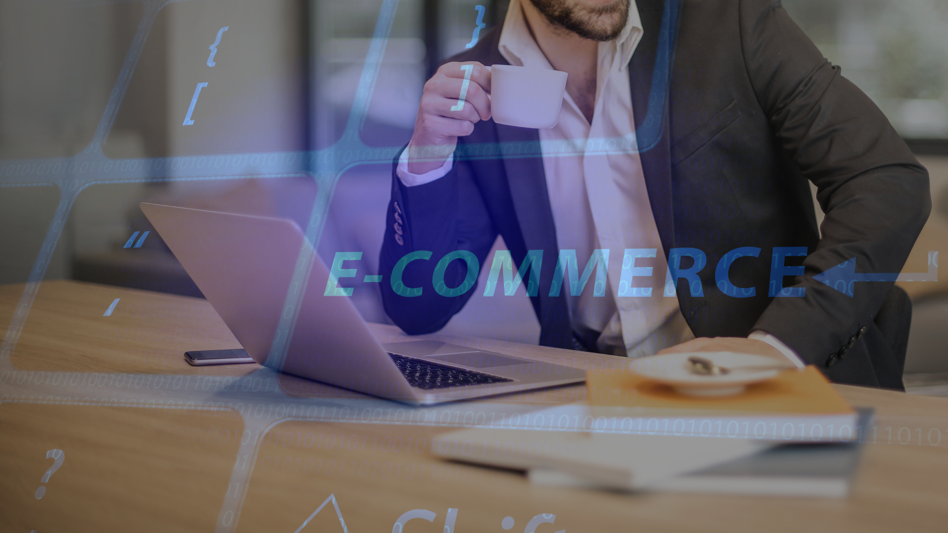 Man in a suit holding a coffee at a laptop, with the digital word E-COMMERCE – what an E-commerce Manager does